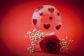 The planet of love. Glass globe with red hearts.
