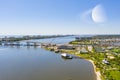 Planet Saturn photoshopped into sky above coastal waterfront Florida scene