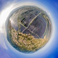 Planet with solar and wind power plant. Eco Friendly, green energy concept. Solar energy town, wind energy. Dirty city Royalty Free Stock Photo