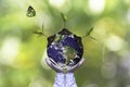 Planet and tree in human hands over green nature ecology, Save the earth concept Royalty Free Stock Photo