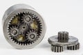 Planetary gear from a small device on a bright table. Gear wheel