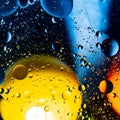 Mixing water and oil on a beautiful color abstract background gradient balls circles and ovals