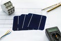 Switching to solar power. Blueprints and solar cells with calculator and electrical equipment Royalty Free Stock Photo