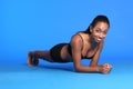 Plank ab exercise by happy African American woman Royalty Free Stock Photo