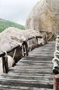 Plank bridge and huge stones boulders, Koh Nanguan, Thailand