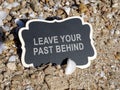 Plank with inscription leave your past behind Royalty Free Stock Photo