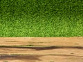 Plank wooden on green artificial turf for background Royalty Free Stock Photo