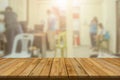 Plank wooden table top and blurred abstract background from interior building banner backdrop with desk blur, counter work people Royalty Free Stock Photo