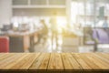 Plank wooden table top and blurred abstract background from interior building banner backdrop with desk blur, counter work people Royalty Free Stock Photo