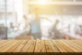 Plank wooden table top and blurred abstract background from interior building banner backdrop with desk blur, counter work people Royalty Free Stock Photo