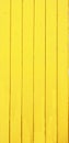 Planks of wood painted yellow - vertical Royalty Free Stock Photo