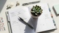 Planner displaying a weekly layout on a desk with a pen resting Royalty Free Stock Photo
