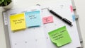A planner displays a week in the month with sticky notes attached Royalty Free Stock Photo