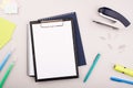 Planner on the grey wooden working table. Blank white paper on working desk Royalty Free Stock Photo