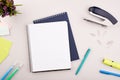 Planner on the grey wooden working table. Blank white paper on working desk Royalty Free Stock Photo
