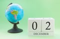 Planner wooden cube with numbers, 2 day of the month of December, winter