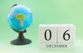 Planner wooden cube with numbers, 6 day of the month of December, winter