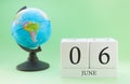 Planner wooden cube with numbers, 6 day of the month of June, summer