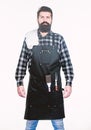 Planning a BBQ. Professional hipster cook. Brutal hipster wearing grilling apron. Bearded hipster ready for preparing