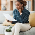 Planning, budget or black woman reading paperwork, bank document and investment report in home. Savings, insurance Royalty Free Stock Photo