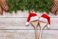 Planning the christmas menu - two wooden spoons with santa hats Royalty Free Stock Photo