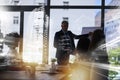 Planning for the future. Shot of a team of brainstorming businesspeople double exposed with an image of a city. Royalty Free Stock Photo