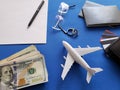 planning the honeymoon trip, rings, eyeglasses, chilean banknotes, passports, credit cards and figure of an airplane, top view