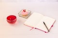 Planning laptop, high angle view of open blank notebook, cup and cupcake Royalty Free Stock Photo