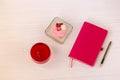 Planning laptop, high angle view of open blank notebook, cup and cupcake Royalty Free Stock Photo