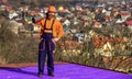 Planning a new construction. new roof under construction residential building. builder use roofing felt. professional Royalty Free Stock Photo