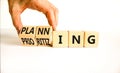 Planning and prioritizing symbol. Concept words Planning and Prioritizing on wooden cubes. Businessman hand. Beautiful white