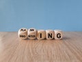 Planning and prioritizing symbol. Concept words Planning and Prioritizing on wooden cubes. Beautiful wooden table, blue background