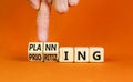 Planning and prioritizing symbol. Concept words Planning and Prioritizing on wooden cubes. Businessman hand. Beautiful orange