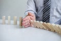 Planning Risk and Strategy in Business, Image of hand Businessman stopping and protection for collapse of wooden block game being Royalty Free Stock Photo