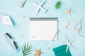 Planning summer holidays, travel and vacation background. Empty notebook with accessories on blue pastel table top view. Flat lay Royalty Free Stock Photo