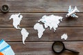 Planning a travel concept. Sketchy map of the world on dark wooden background top view Royalty Free Stock Photo