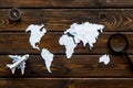 Planning a travel concept. Sketchy map of the world on dark wooden background top view Royalty Free Stock Photo