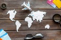 Planning a travel concept. Sketchy map of the world on dark wooden background top view Royalty Free Stock Photo