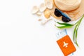 Summer travaling to the sea with straw hat, sun glasses, tickets and passport on white background top view mock up Royalty Free Stock Photo