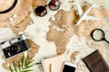 Planning vacation, travel plan, trip vacation using world map along with other travel accessories. Top view, flat lay. Royalty Free Stock Photo