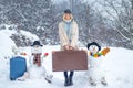 Planning winter vacations. Winter holiday. Winter World Travel. Happy young girl playing in fresh snow and making