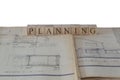 Planning written on wooden blocks on house extension building plans blueprints Royalty Free Stock Photo