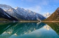Plansee lake spring panorama with snow on mount top, Tyrol, Austria.