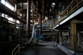 plant, with pipes and equipment running through the facility, producing ores