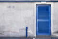 Plant room blue door with louvre ventilation