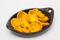 Plantain cups on black ceramic dish Royalty Free Stock Photo