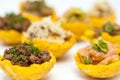 Plantain cups filled with different types of stuffing Royalty Free Stock Photo