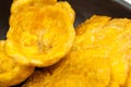 Plantain cups and patacones on black ceramic dish Royalty Free Stock Photo
