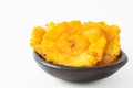 Plantain patacones on black dish Royalty Free Stock Photo