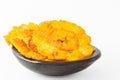 Plantain patacones on black dish Royalty Free Stock Photo